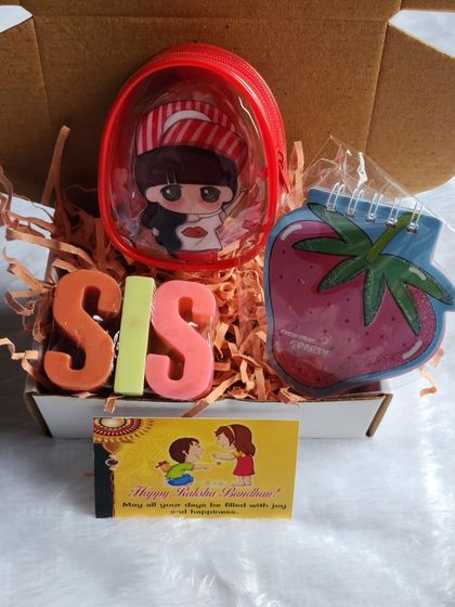 Another adorable Rakhi hamper for a sister, combining my handmade soaps with cute stationery and a small purse.