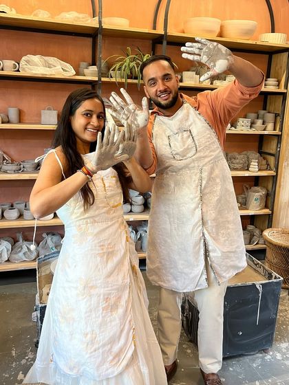 That "we did it" feeling. Getting your hands dirty is part of the fun, and these two are celebrating a successful and messy taster session.