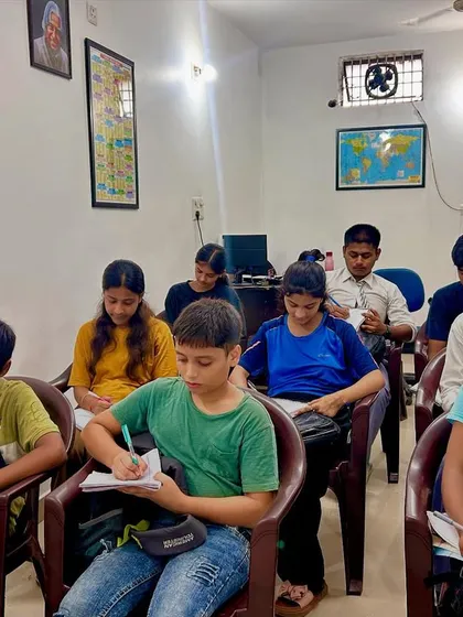 Welcome to my Success Academy. Here, we create a focused learning environment where every student gets the attention they need. This image shows a typical session where students are deeply engaged in their work, building a solid foundation for their exams.