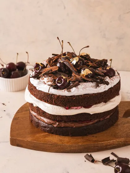 My Black Forest cake is an experience. Swipe to see what makes it so irresistible, from the moist egg-free sponge to the edible gold leaf on top.