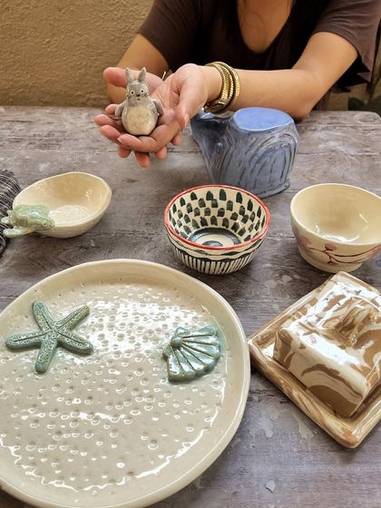 The full collection of a beginner student's work, showcasing a range of techniques from wheel throwing and Nerikomi to hand-building and sculpture. So much progress in one course.