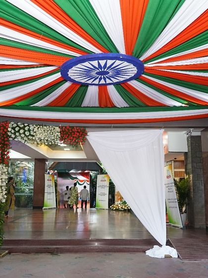 The entrance to the Income Tax Department building, decorated with tricolor draping for a national celebration. We can transform building facades to match the festive spirit of an event.