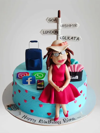 A cake for a woman who loves to travel and is always on social media. This design features a fondant figurine, a suitcase, and logos of her favorite apps and destinations.