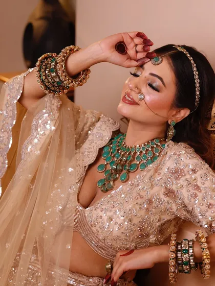 A close-up showing the details of the jewelry and the soft, blended makeup.