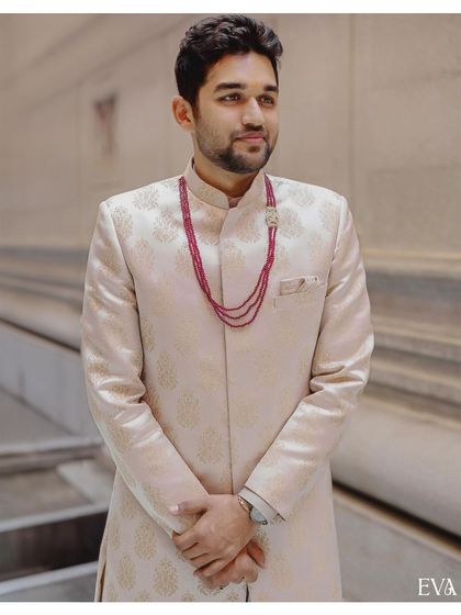 A handsome portrait of the groom-to-be, Madhusudhan, looking sharp in his traditional engagement attire.