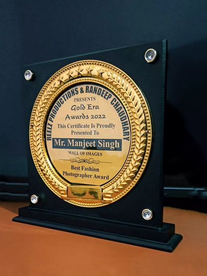 The Gold Era Awards 2022 plaque, recognizing Mr. Manjeet Singh of Wall of Images as the Best Fashion Photographer.