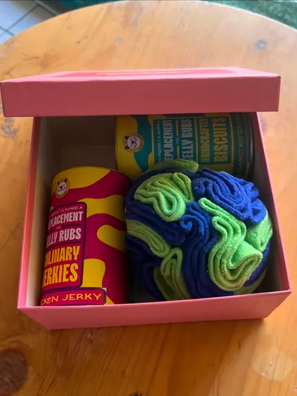A slightly different angle of the gift box, showing the vibrant packaging of my treat cans.