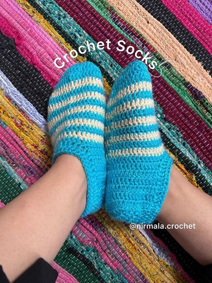 Simple, cozy, and warm. These striped crochet socks in blue and white are a winter essential for keeping your feet comfortable on cold floors.