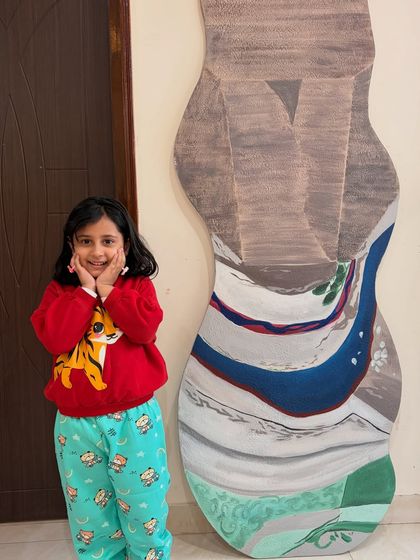 A happy moment with the finished custom-shaped painting. I love creating pieces that are so unique and tailored to a client's vision.