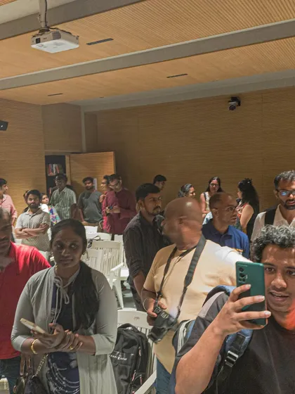 A crowd of attendees at an event, capturing the bustling and lively atmosphere.