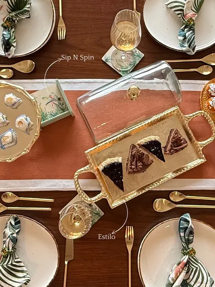 This view of our festive table showcases our Estilo serving tray with a glass cloche and our Sip N Spin coasters. Each piece is designed to create sweet moments, styled beautifully.