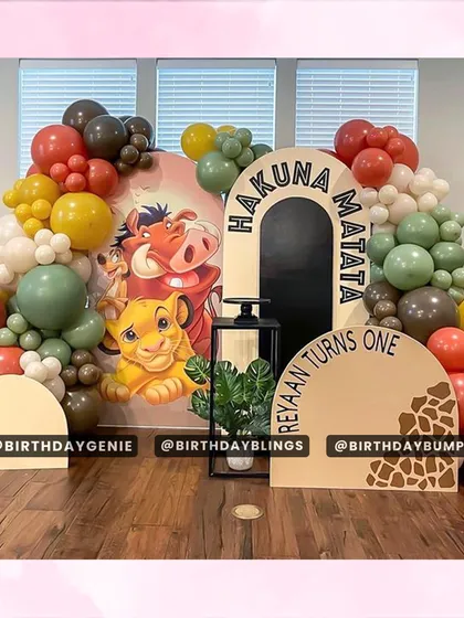 Our "Hakuna Matata" Lion King theme for a first birthday, featuring custom-printed backdrops, character cutouts, and a colorful balloon arrangement.