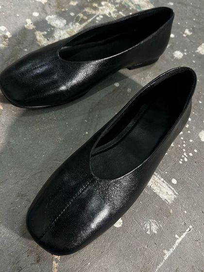 The first sample of a new minimalist ballet flat in black leather. I'm focusing on a clean, seamless look with a modern square toe. This is where it all begins, with an idea and a perfectly crafted prototype.