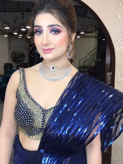 This look is all about making a statement. I used a vibrant, colorful cut-crease eye makeup technique paired with a flawless base for a client attending a cocktail party.
