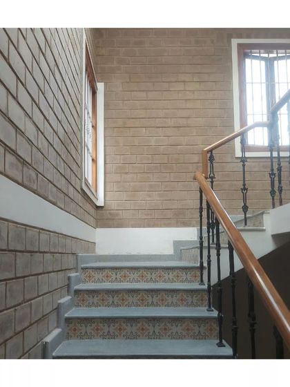 A staircase featuring patterned tiles on the risers, adding a decorative touch to a functional element.