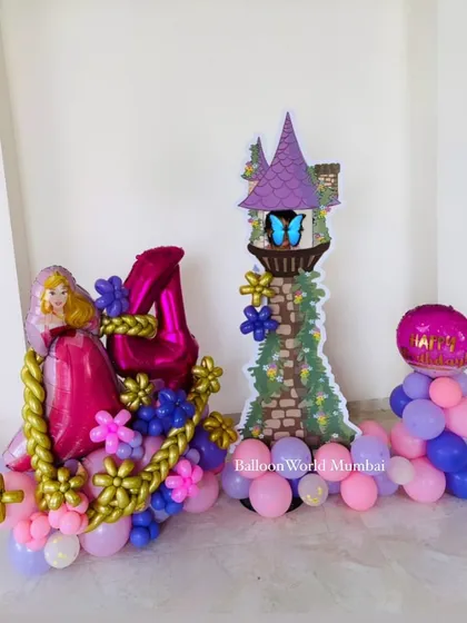 A fairytale moment with this Rapunzel-themed balloon structure. We created a custom tower and a Rapunzel figure made entirely of balloons for a magical 4th birthday.