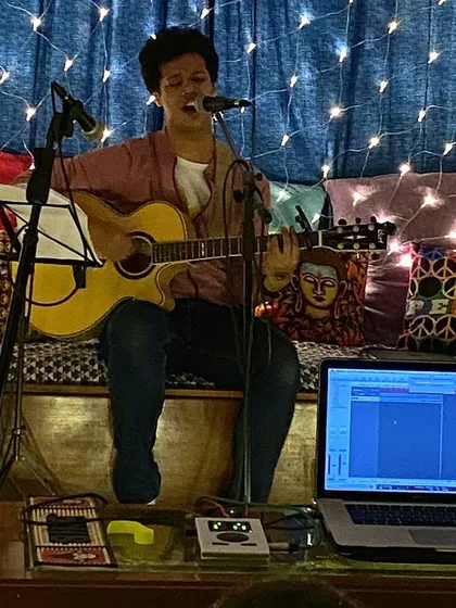 Performing at a house gig hosted by The Hertz Cave. I love these intimate shows. The fairy lights, the cozy setup, it’s the perfect atmosphere for sharing my original songs and connecting with the audience.