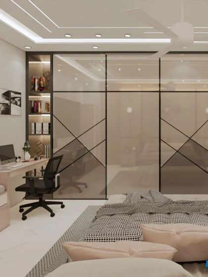 A bedroom designed for a student or professional, with a large study desk and a sleek, modern glass wardrobe.