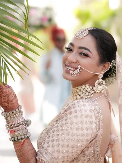 A happy, smiling bride enjoying her morning wedding. Her natural and radiant makeup look is perfect for the occasion.