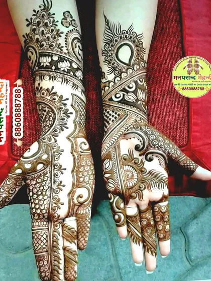 This is a gorgeous example of an Indo-Arabic mehndi design. It combines the bold, flowing vines of Arabic style with the delicate, filled patterns of Indian henna, creating a balanced and modern look for any occasion.