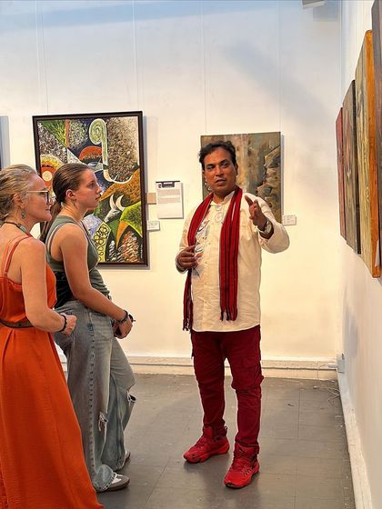 Explaining my artwork to international visitors at the art exhibition in Colombo, Sri Lanka.
