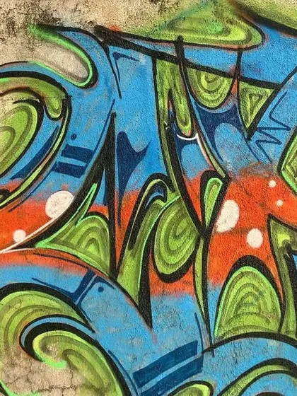 Another detail shot from the graffiti jam, focusing on the intricate line work and color patterns within the letters.