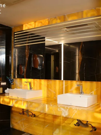 Another perspective of the well-lit and spacious washroom facilities. I ensure these areas are always spotless and fully stocked, so you can freshen up in comfort and style.