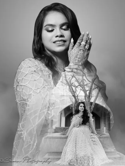 A creative black and white double exposure, blending the bride's portrait with an outdoor scene.