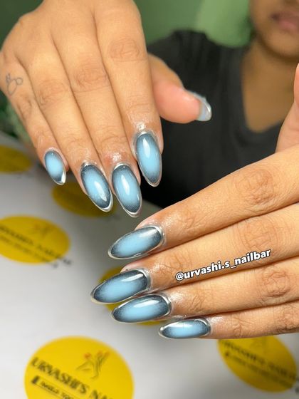 This is a futuristic take on the aura trend. I used a light blue center with a dark outline and a silver chrome border to create a striking, modern design.