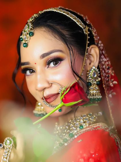 Using props like a single rose can add a touch of romance to a bridal photoshoot. Our portfolio development sessions include guidance on posing and composition.