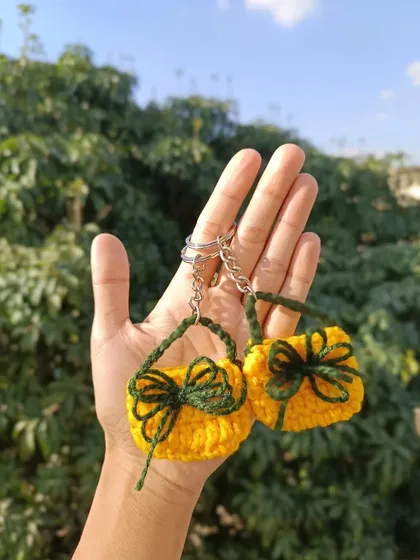 A fun and unique design: miniature crochet bag keychains. These tiny accessories are a testament to the detailed work I can do.