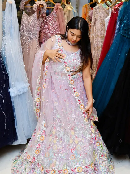 A full view of this intricately detailed lavender lehenga, showing its flow and the beautiful craftsmanship you get when you rent from me.