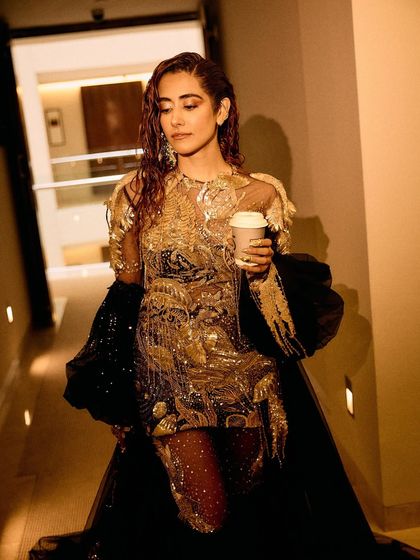 A series of images capturing the stunning Rahul Mishra Couture outfit I styled for Jonita Gandhi's performance. The detailed embroidery, flowing silhouette, and pairing with thigh-high Louboutin boots created a look that was both ethereal and powerful.