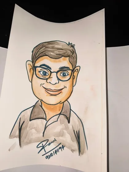 This caricature of a guest with glasses shows the artist's skill in capturing distinctive features in a fun and lighthearted way.