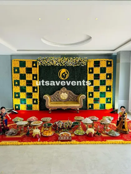 Another angle of the baby shower setup in a convention hall, showing the scale and beauty of the traditional decor.