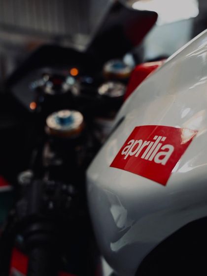 The Aprilia logo on the nose of the Alitalia-liveried RSV4.