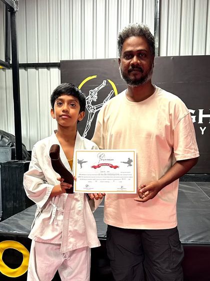 Another student proudly displaying his new belt and certificate. Our belt exams are an important part of the karate journey, marking progress and achievement.