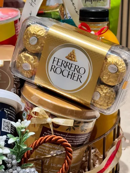 A close-up look at the gourmet selections I include in my corporate hampers. This particular curation for Qatar Airways features premium Ferrero Rocher chocolates, showcasing the high-quality brands I partner with to create impressive business gifts.
