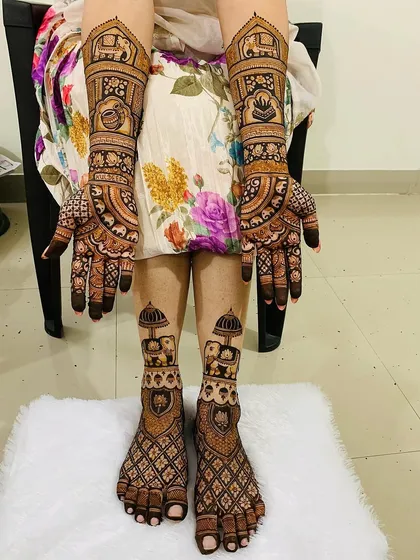 A complete bridal mehndi set for a truly royal look. This design covers both hands and feet with coordinated patterns, featuring traditional elephant motifs, intricate jaal work, and auspicious symbols for a cohesive and stunning bridal look.