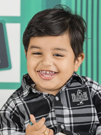 A happy customer at the baby Starbucks cafe. This theme is always a hit with parents.