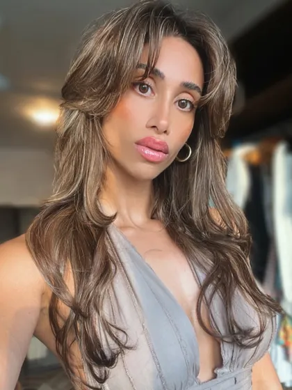 A closer look at a client's beautifully highlighted extensions. The mix of tones creates a natural, sophisticated look with plenty of depth and movement.