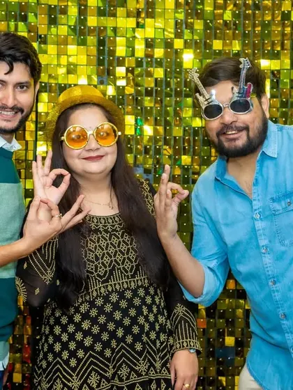 Adults love the props just as much as the children. These guests are striking a pose with their fun glasses, enjoying the photo booth moment.