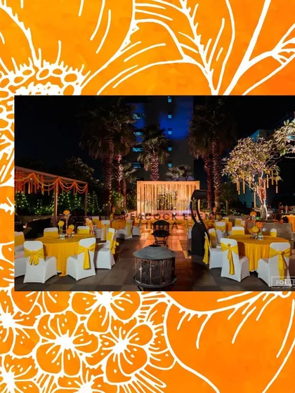 This outdoor Haldi setup at the Taj Gurgaon features bright yellow table linens and chair ties, perfectly complementing the traditional marigold decor and creating a cohesive, festive look.