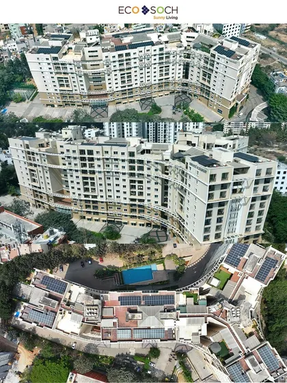 Another view of the same curved building, providing different angles to fully document the solar project for EcoSoch Solar.