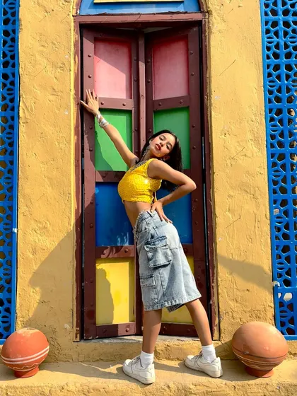 Another shot from the colorful door series, capturing a dynamic and joyful pose.