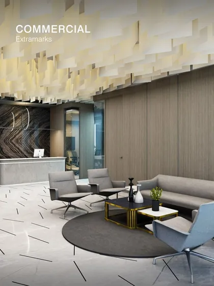 The commercial interior for Extramarks features a refined reception and waiting area. We used a combination of marble-patterned flooring, wood-panelled walls, and a suspended ceiling feature to create a professional and welcoming first impression.
