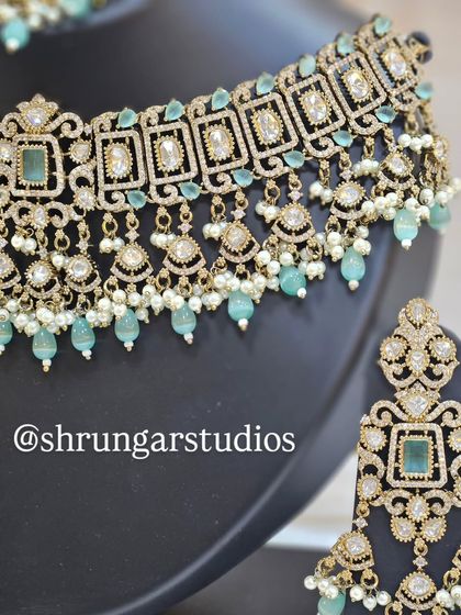 Another detailed shot of the mint green choker, highlighting the square-cut stones and pearl drops.