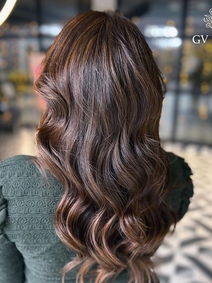 When your hair shines brighter than your future plans. A beautiful, rich brown with soft, flowing waves.