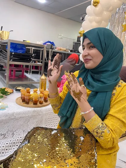 A pretty smile with pretty henna. A simple design for a guest at a party.
