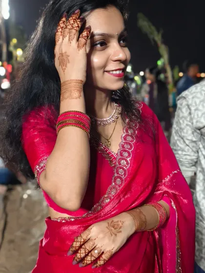 The festive look for Chhath Puja, with simple lotus mehndi complementing the traditional attire.